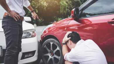 Two drivers man arguing after a car traffic accident collision,